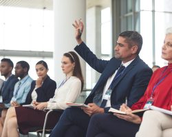 Side view of diverse business people attending a business seminar in office building